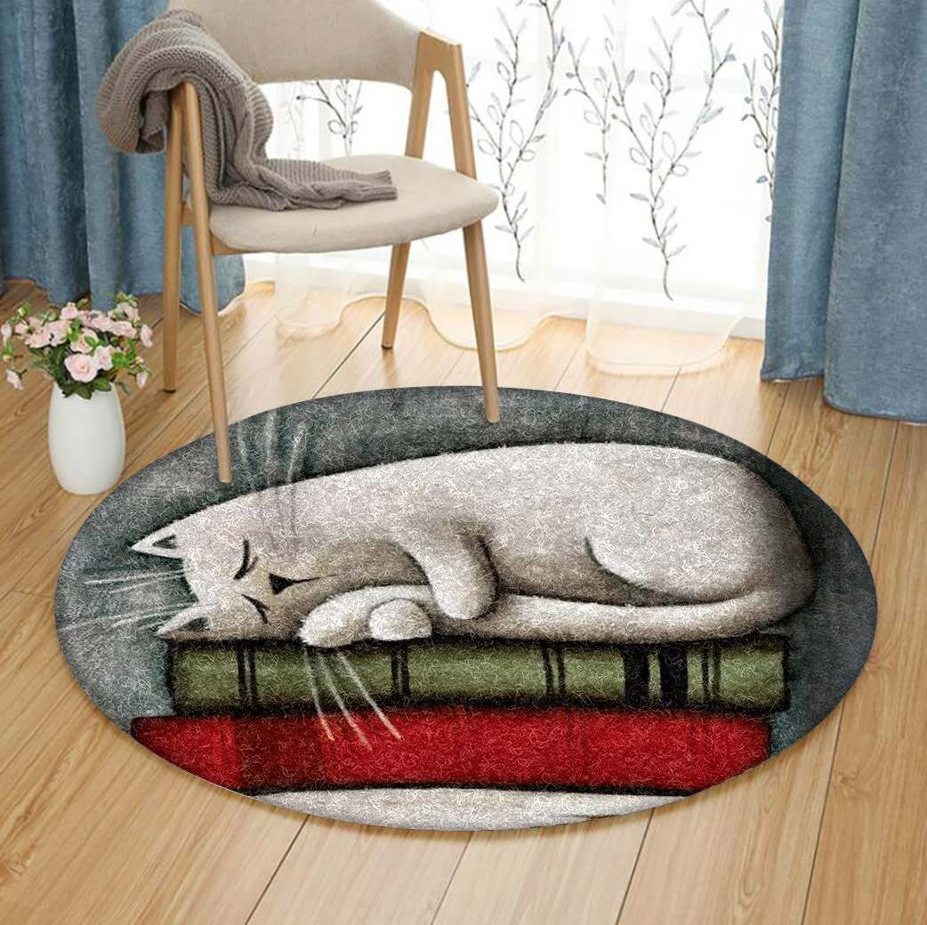 Cat Sleep On Book Round Carpet